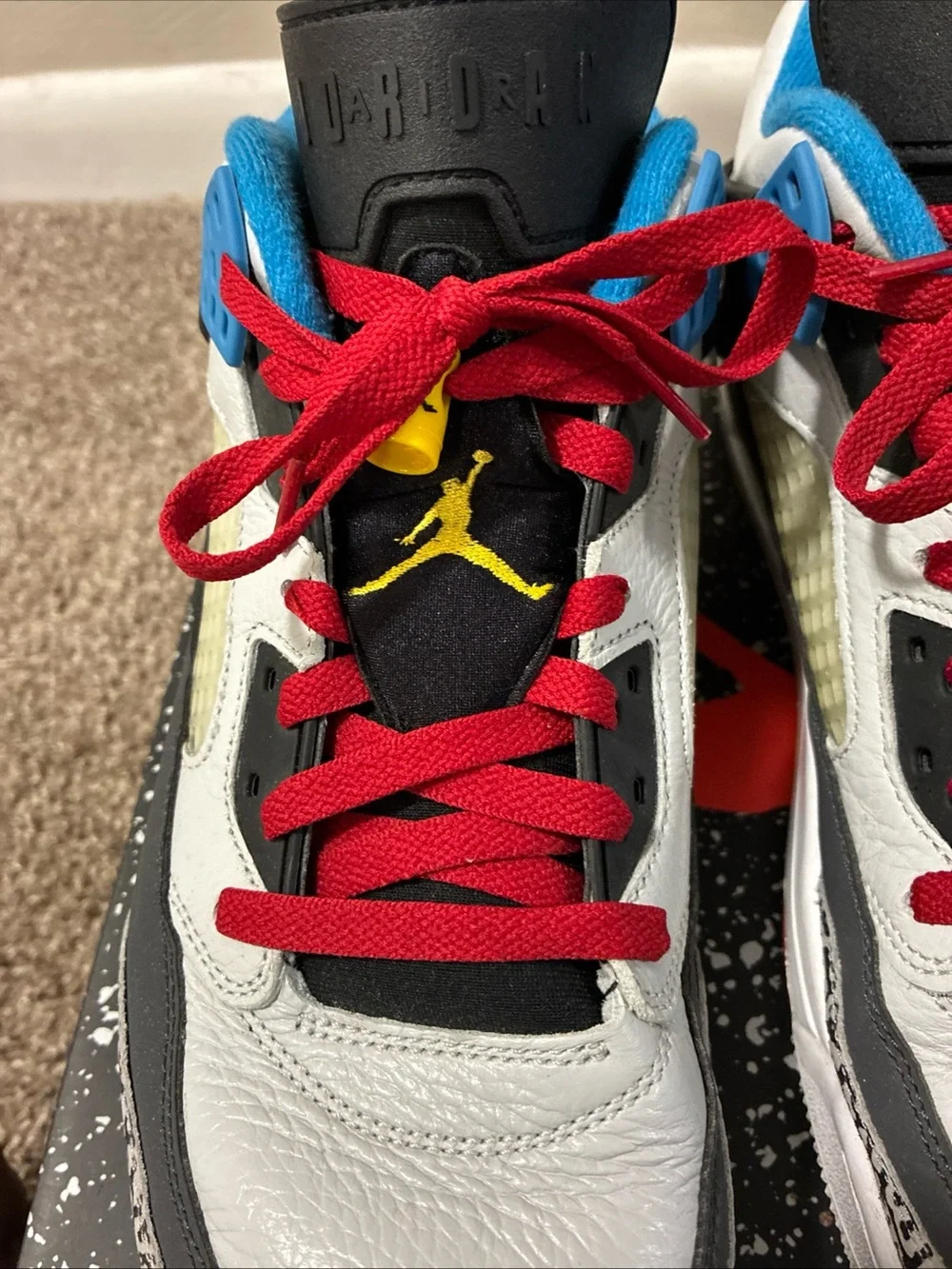 Jordan Men's White Athletic Shoes with Black, Red & Blue Accents
